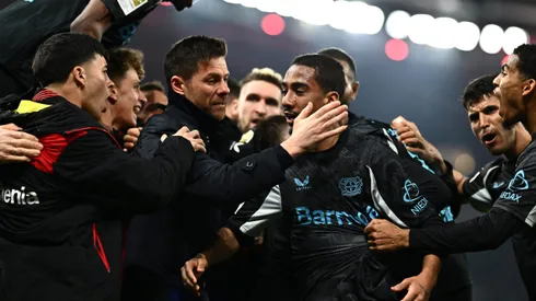 STUTTGART, GERMANY - MARCH 16: Xabi Alonso, Head Coach of Bayer 04 Leverkusen, embraces his player Arthur after their side's victory in the Bundesliga match between VfB Stuttgart and Bayer 04 Leverkusen at MHPArena on March 16, 2025 in Stuttgart, Germany. (Photo by Daniel Kopatsch/Getty Images)
