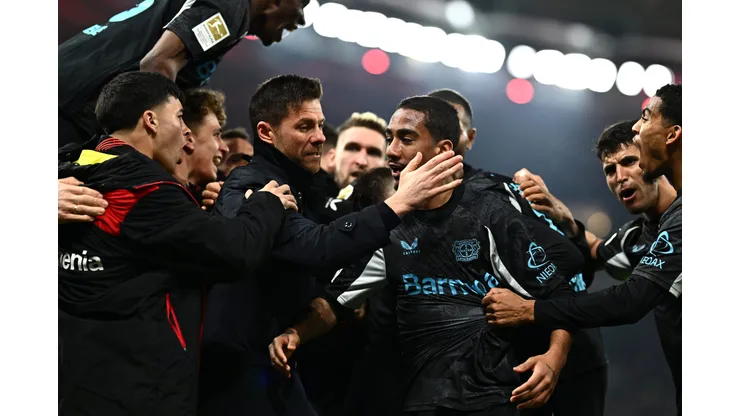 STUTTGART, GERMANY - MARCH 16: Xabi Alonso, Head Coach of Bayer 04 Leverkusen, embraces his player Arthur after their side's victory in the Bundesliga match between VfB Stuttgart and Bayer 04 Leverkusen at MHPArena on March 16, 2025 in Stuttgart, Germany. (Photo by Daniel Kopatsch/Getty Images)