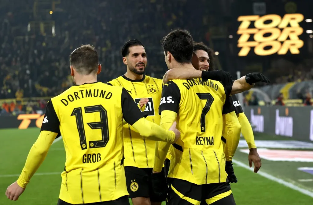 DORTMUND, GERMANY – DECEMBER 15: Giovanni Reyna of Borussia Dortmund celebrates scoring his team’s first goal during the Bundesliga match between Borussia Dortmund and TSG 1899 Hoffenheim at Signal Iduna Park on December 15, 2024 in Dortmund, Germany. (Photo by Christof Koepsel/Getty Images)