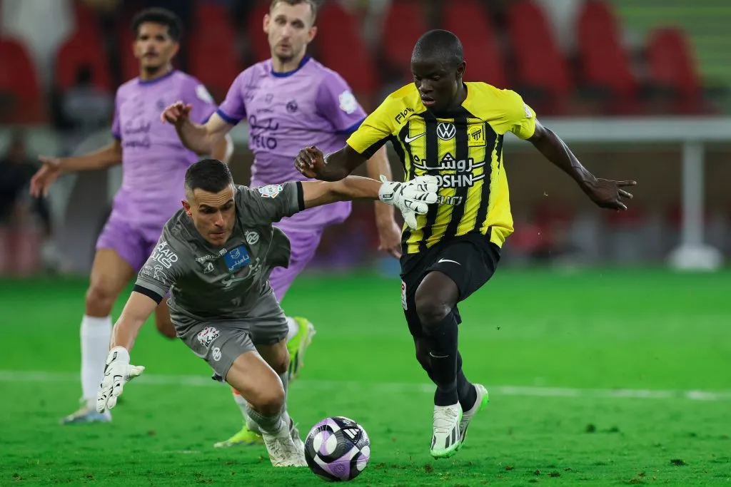 JEDDAH, SAUDI ARABIA – FEBRUARY 1: Ngolo Kante of Al Ittihad challenged by Marcelo Grohe of Al Kholood during the Saudi Pro League match between Al Ittihad and Al Kholood at Prince Abduallah Al Faisal Stadium on February 1, 2025 in Jeddah, Saudi Arabia. (Photo by Yasser Bakhsh/Getty Images)