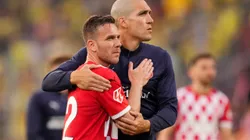 GIRONA, SPAIN - MAY 10: Arthur Melo and Oriol Romeu of Girona FC embrace following the team's defeat during the LaLiga match between Girona FC and Villarreal CF at Montilivi Stadium on May 10, 2025 in Girona, Spain. (Photo by Alex Caparros/Getty Images)