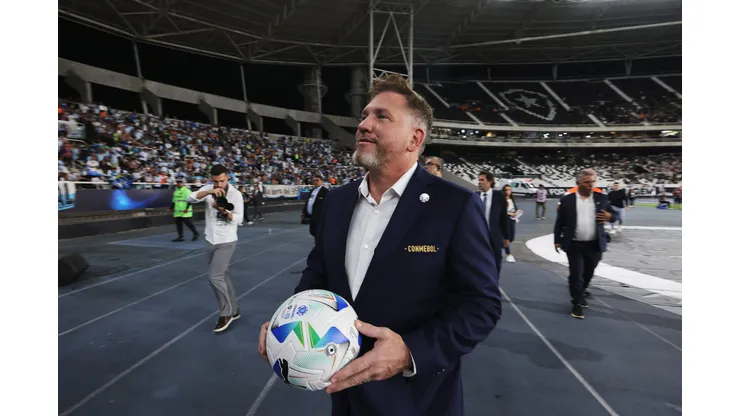 RIO DE JANEIRO, BRAZIL - FEBRUARY 27: President of CONMEBOL Alejandro Dominguez approaches the stands to girft a ball to fans prior to the Recopa Sudamericana 2025 Second Leg match between Botafogo and Racing Club at Estadio Olímpico Nilton Santos on February 27, 2025 in Rio de Janeiro, Brazil. (Photo by Wagner Meier/Getty Images)