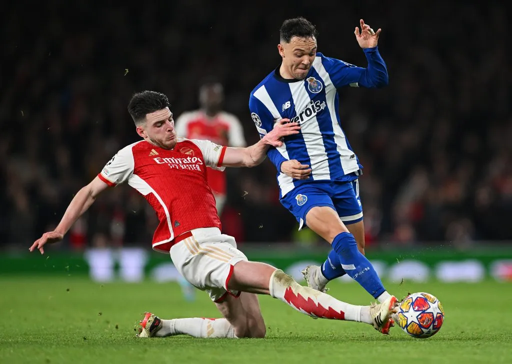 LONDON, ENGLAND – MARCH 12: Pepe of FC Porto is challenged by Declan Rice of Arsenal during the UEFA Champions League 2023/24 round of 16 second leg match between Arsenal FC and FC Porto at Emirates Stadium on March 12, 2024 in London, England. (Photo by Shaun Botterill/Getty Images)