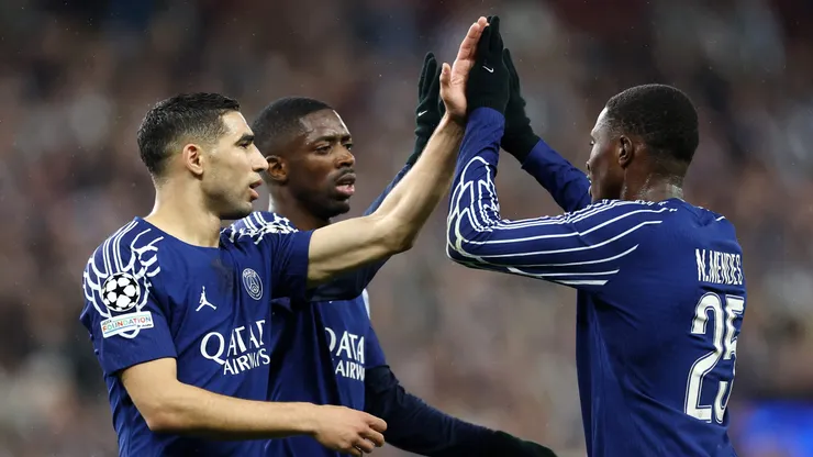 BIRMINGHAM, ENGLAND - APRIL 15: Nuno Mendes of Paris Saint-Germain celebrates with teammates Ousmane Dembele and Achraf Hakimi after scoring his team's second goal during the UEFA Champions League 2024/25 Quarter Final Second Leg match between Aston Villa FC and Paris Saint-Germain at Villa Park on April 15, 2025 in Birmingham, England. (Photo by Dan Istitene/Getty Images)