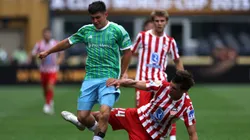SEATTLE, WASHINGTON - JUNE 19: Kalani Kossa-Rienzi #85 of Seattle Sounders FC is challenged by Robin Le Normand #24 of Atletico De Madrid during the FIFA Club World Cup 2025 group B match between Seattle Sounders FC and Club Atletico de Madrid at Lumen Field on June 19, 2025 in Seattle, Washington. (Photo by Buda Mendes/Getty Images)