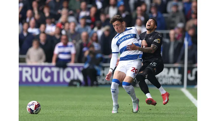 LONDON, ENGLAND - APRIL 21: Reggie Cannon of Queens Park Rangers fouls Ronald of Swansea City during the Sky Bet Championship match between Queens Park Rangers FC and Swansea City AFC at Loftus Road on April 21, 2025 in London, England. (Photo by Warren Little/Getty Images)