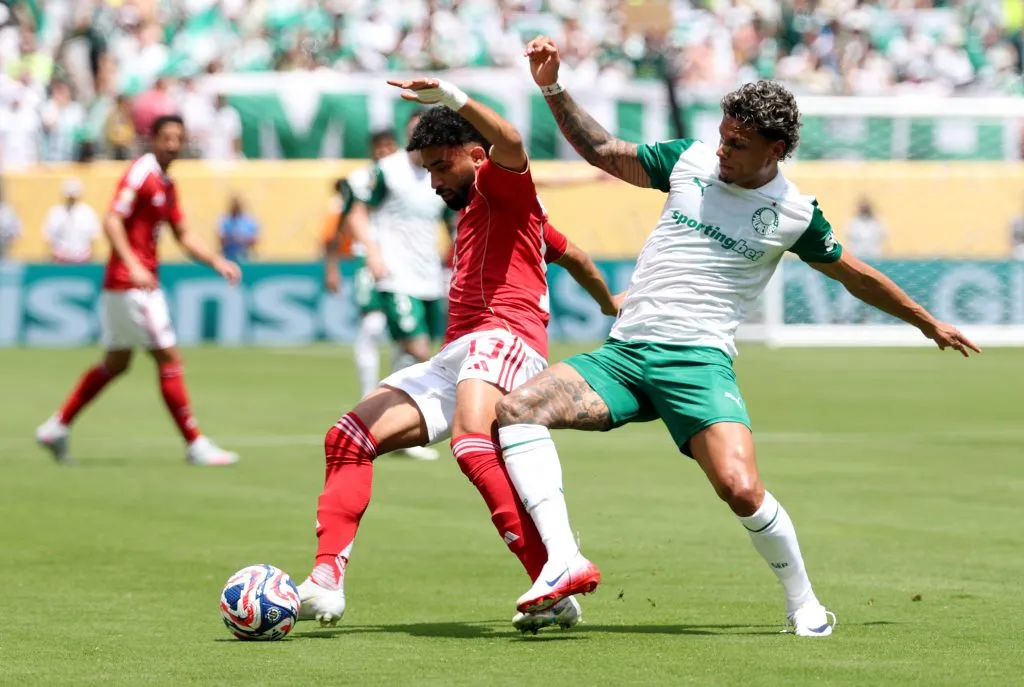 EAST RUTHERFORD, NEW JERSEY – JUNE 19: Marawan Attia #13 of Al Ahly FC is challenged by Richard Rios #8 of Palmeiras during the FIFA Club World Cup 2025 group A match between SE Palmeiras and Al Ahly SC at MetLife Stadium on June 19, 2025 in East Rutherford, New Jersey. (Photo by Al Bello/Getty Images)