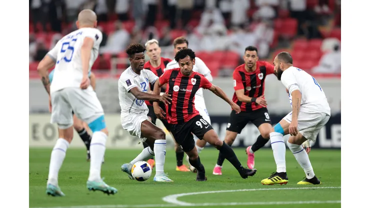 AL RAYYAN, QATAR - FEBRUARY 18: Romarinho of Al-Rayyan is challenged by Ibrahim Ndong of Esteghlal during the AFC Champions League Elite match between Al-Rayyan and Esteghlal at Ahmad bin Ali Stadium on February 18, 2025 in Al Rayyan, Qatar. (Photo by Mohamed Farag/Getty Images)