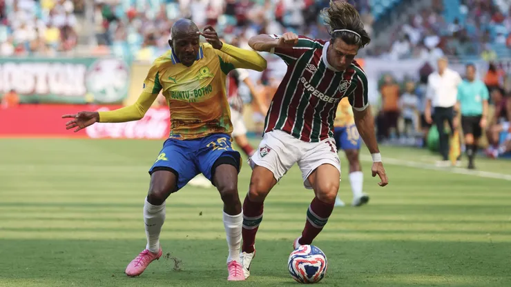 MIAMI GARDENS, FLORIDA - JUNE 25: Agustin Canobbio #17 of Fluminense FC is challenged by Khuliso Mudau #25 of Mamelodi Sundowns FC during the FIFA Club World Cup 2025 group F match between Mamelodi Sundowns FC and Fluminense FC at Hard Rock Stadium on June 25, 2025 in Miami Gardens, Florida. (Photo by Megan Briggs/Getty Images)