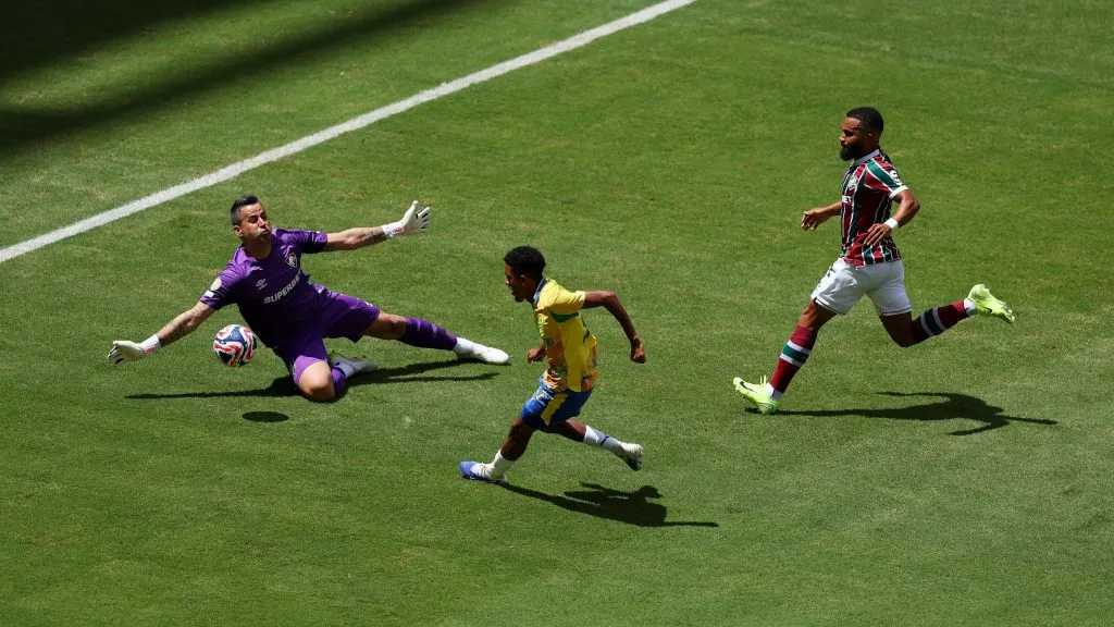 MIAMI GARDENS, FLORIDA – JUNE 25: Tashreeq Matthews #17 of Mamelodi Sundowns FC attempts a shot on goal while under pressure from Fabio #1 of Fluminense FC during the FIFA Club World Cup 2025 group F match between Mamelodi Sundowns FC and Fluminense FC at Hard Rock Stadium on June 25, 2025 in Miami Gardens, Florida. (Photo by Dan Mullan/Getty Images)