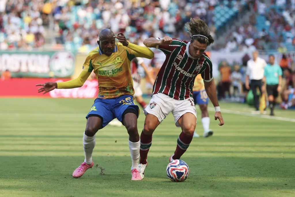 MIAMI GARDENS, FLORIDA – JUNE 25: Agustin Canobbio #17 of Fluminense FC is challenged by Khuliso Mudau #25 of Mamelodi Sundowns FC during the FIFA Club World Cup 2025 group F match between Mamelodi Sundowns FC and Fluminense FC at Hard Rock Stadium on June 25, 2025 in Miami Gardens, Florida. (Photo by Megan Briggs/Getty Images)