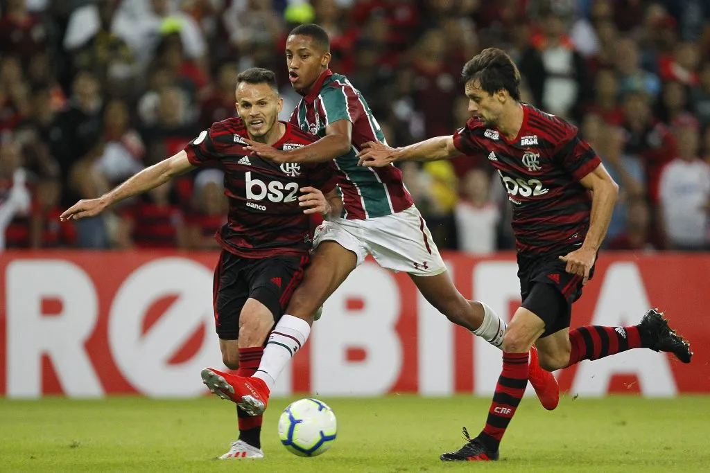 RIO DE JANEIRO, BRAZIL – JUNE 09: Joao Pedro of Fluminense (center) with Rene and Rodrigo Caio of Flamengo during a match between Fluminense and Flamengo as part of the Brasileirao Series A championship at Maracana Stadium on June 9, 2019 in Rio de Janeiro, Brazil. (Photo by Wagner Meier/Getty Images)