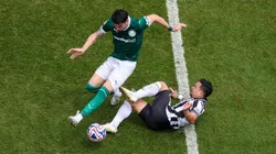 PHILADELPHIA, PENNSYLVANIA - JUNE 28: Joaquin Piquerez #22 of Palmeiras is tackled by Artur #7 of Botafogo during the FIFA Club World Cup 2025 round of 16 match between SE Palmeiras and Botafogo FR at Lincoln Financial Field on June 28, 2025 in Philadelphia, Pennsylvania. (Photo by Al Bello/Getty Images)