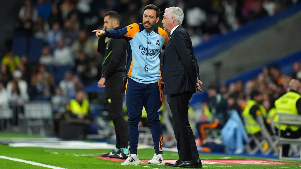 MADRID, SPAIN – MAY 14: Davide Ancelotti, Assistant Manager of Real Madrid, speaks with Carlo Ancelotti, Head Coach of Real Madrid, during the LaLiga match between Real Madrid CF and RCD Mallorca at Estadio Santiago Bernabeu on May 14, 2025 in Madrid, Spain. (Photo by Angel Martinez/Getty Images)