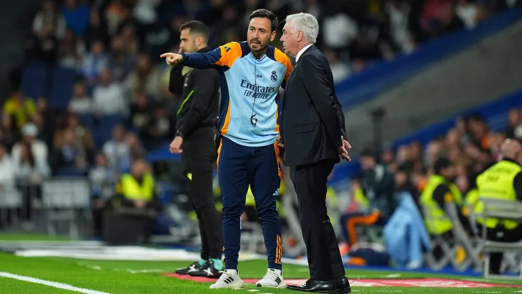 MADRID, SPAIN – MAY 14: Davide Ancelotti, Assistant Manager of Real Madrid, speaks with Carlo Ancelotti, Head Coach of Real Madrid, during the LaLiga match between Real Madrid CF and RCD Mallorca at Estadio Santiago Bernabeu on May 14, 2025 in Madrid, Spain. (Photo by Angel Martinez/Getty Images)