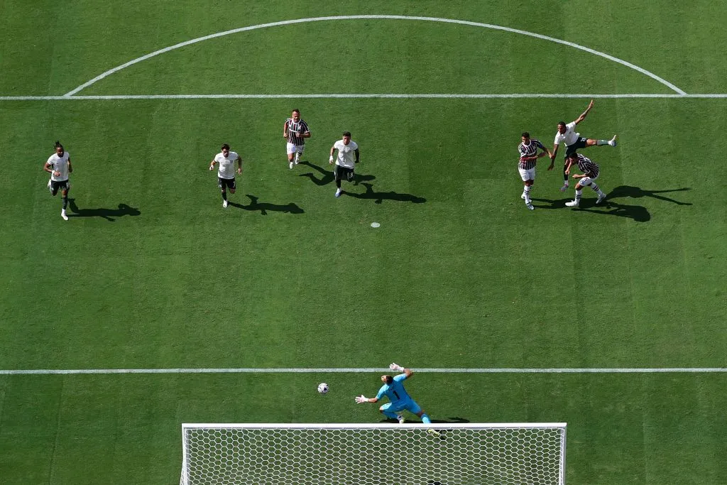 EAST RUTHERFORD, NEW JERSEY – JULY 08: Joao Pedro of Chelsea FC scores his team’s second goal past Fabio #1 of Fluminense FC during the FIFA Club World Cup 2025 semi-final match between Fluminense FC and Chelsea FC at MetLife Stadium on July 08, 2025 in East Rutherford, New Jersey. (Photo by Luke Hales/Getty Images)