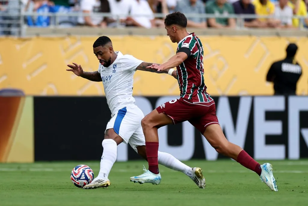 ORLANDO, FLORIDA – JULY 04: Malcom #77 of Al Hilal is challenged by Facundo Bernal #5 of Fluminense FC during the FIFA Club World Cup 2025 quarter final match between Fluminense FC and Al Hilal at Camping World Stadium on July 04, 2025 in Orlando, Florida. (Photo by Buda Mendes/Getty Images)