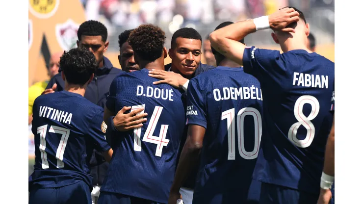 EAST RUTHERFORD, NEW JERSEY - JULY 09: Kylian Mbappe #9 of Real Madrid C.F. embraces Desire Doue #14 of Paris Saint-Germain prior to the FIFA Club World Cup 2025 semi-final match between Paris Saint-Germain and Real Madrid CF at MetLife Stadium on July 09, 2025 in East Rutherford, New Jersey. (Photo by David Ramos/Getty Images)