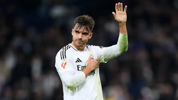 MADRID, SPAIN - FEBRUARY 08: Raul Asencio of Real Madrid acknowledges the fans after the LaLiga match between Real Madrid CF and Atletico de Madrid at Estadio Santiago Bernabeu on February 08, 2025 in Madrid, Spain. (Photo by Angel Martinez/Getty Images)