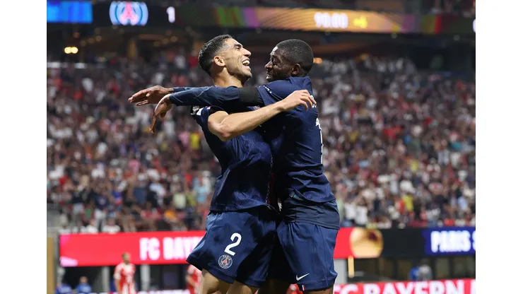 ATLANTA, GEORGIA - JULY 05: Ousmane Dembele #10 of Paris Saint-Germain celebrates scoring his team's second goal with teammate Achraf Hakimi #2 during the FIFA Club World Cup 2025 quarter-final match between Paris Saint-Germain and FC Bayern München at Mercedes-Benz Stadium on July 05, 2025 in Atlanta, Georgia. (Photo by Kevin C. Cox/Getty Images)