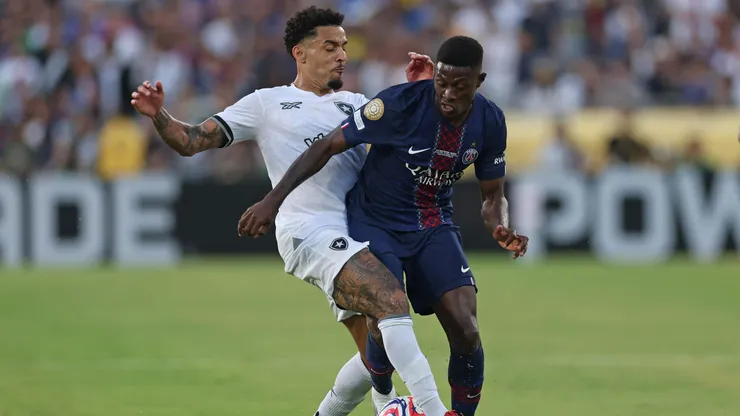 PASADENA, CALIFORNIA - JUNE 19: Nuno Mendes #25 of Paris Saint-Germain is challenged by Gregore #26 of Botafogo during the FIFA Club World Cup 2025 group B match between Paris Saint-Germain FC and Botafogo FR at Rose Bowl Stadium on June 19, 2025 in Pasadena, California. (Photo by Stu Forster/Getty Images)