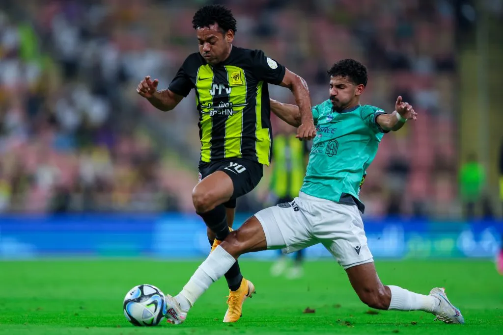 JEDDAH, SAUDI ARABIA – APRIL 5: Romarinho of Al Ittihad battling for the ball during the Saudi Pro League match between Al-Ittihad and Al-Taawoun at King Abdullah Sport City Stadium on April 5, 2024 in Jeddah, Saudi Arabia.(Photo by Yasser Bakhsh/Getty Images)