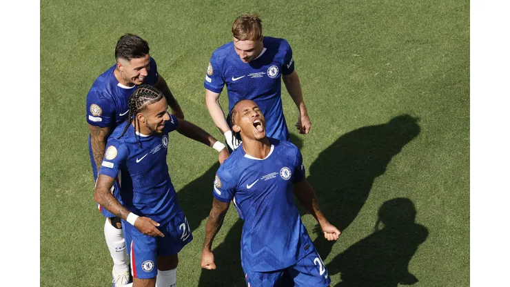 EAST RUTHERFORD, NEW JERSEY - JULY 13: Joao Pedro #20 of Chelsea FC celebrates scoring his team's third goal with Malo Gusto #27, Cole Palmer #10 and Enzo Fernandez #8 of Chelsea FC during the FIFA Club World Cup 2025 Final match between Chelsea FC and Paris Saint-Germain at MetLife Stadium on July 13, 2025 in East Rutherford, New Jersey. (Photo by Michael Reaves/Getty Images)