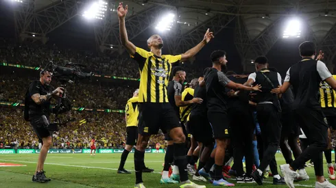 JEDDAH, SAUDI ARABIA - MAY 30: Fabinho of Al-Ittihad celebrates after Karim Benzema of Al-Ittihad (obscured) scores his team's third goal during the Final King's Cup match between Al Ittihad and Al Qadsiah at King Abdullah Sports City on May 30, 2025 in Jeddah, Saudi Arabia. (Photo by Yasser Bakhsh/Getty Images)