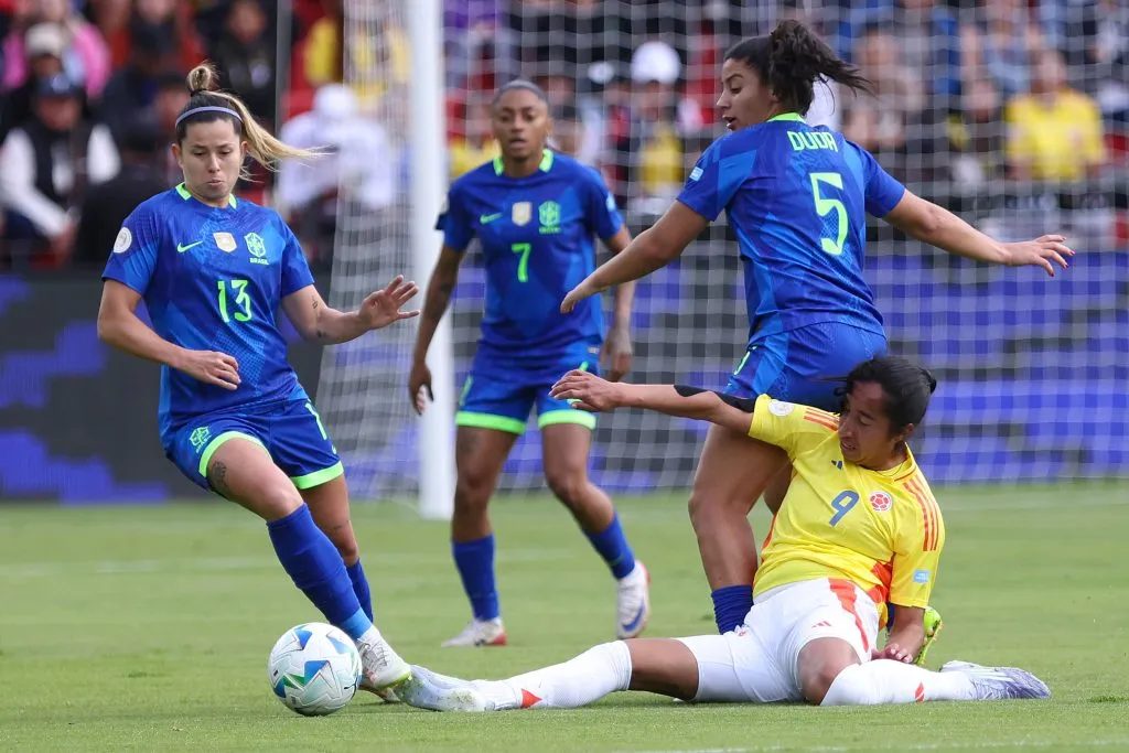 QUITO, ECUADOR – AUGUST 2: Mayra Ramirez of Colombia battles for possession against Duda Sampaio and Fernanda Palermo of Brazil during the CONMEBOL Copa America Femenina 2025 Final match between Colombia and Brazil at Rodrigo Paz Delgado Stadium on August 2, 2025 in Quito, Ecuador.  (Photo by Franklin Jacome/Getty Images)
