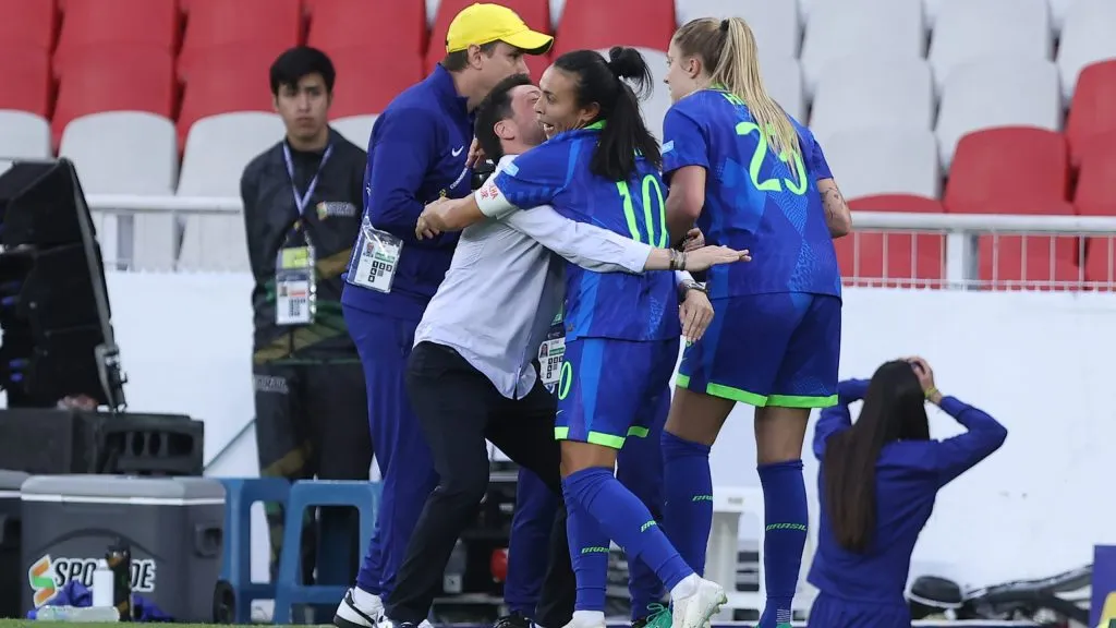 QUITO, ECUADOR – AUGUST 2: Marta Vieira of Brazil celebrates with head coach Arthur Elias of Brazil after scoring the team’s third goal during the CONMEBOL Copa America Femenina 2025 Final match between Colombia and Brazil at Rodrigo Paz Delgado Stadium on August 2, 2025 in Quito, Ecuador. (Photo by Franklin Jacome/Getty Images)