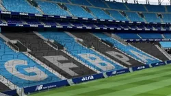 Montagem com as iniciais do Grêmio estampadas nas arquibancadas.