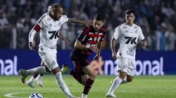SANTOS, BRAZIL - JULY 16: Neymar of Santos competes for the ball with Jorginho of Flamengo during the Brasileirao 2025 match between Santos and Flamengo at Urbano Caldeira Stadium (Vila Belmiro) on July 16, 2025 in Santos, Brazil. (Photo by Ricardo Moreira/Getty Images)