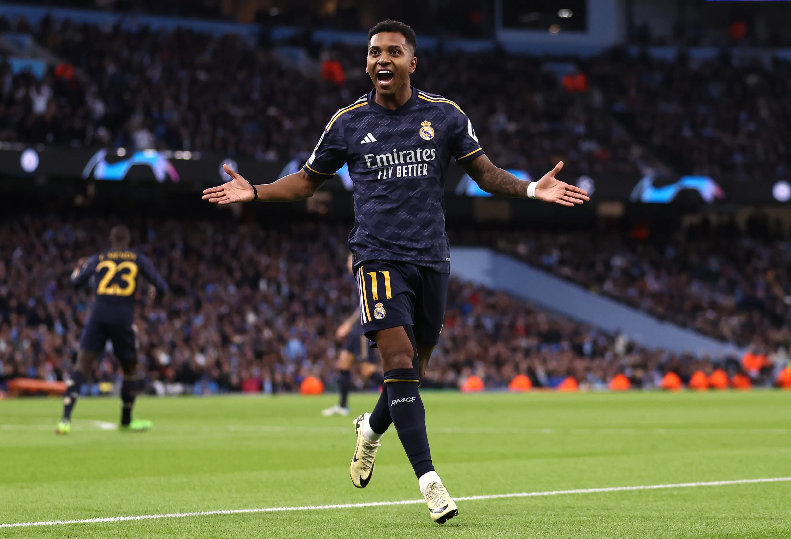 MANCHESTER, ENGLAND – APRIL 17: Rodrygo of Real Madrid celebrates scoring his team’s first goal during the UEFA Champions League quarter-final second leg match between Manchester City and Real Madrid CF at Etihad Stadium on April 17, 2024 in Manchester, England. (Photo by Naomi Baker/Getty Images)