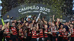 LIMA, PERU - NOVEMBER 29: Giorgian de Arrascaeta and Bruno Henrique of Flamengo lift the Champion's trophy after winning the the 2025 Copa CONMEBOL Libertadores Final match between Palmeiras and Flamengo at Estadio Monumental on November 29, 2025 in Lima, Peru. (Photo by Buda Mendes/Getty Images)