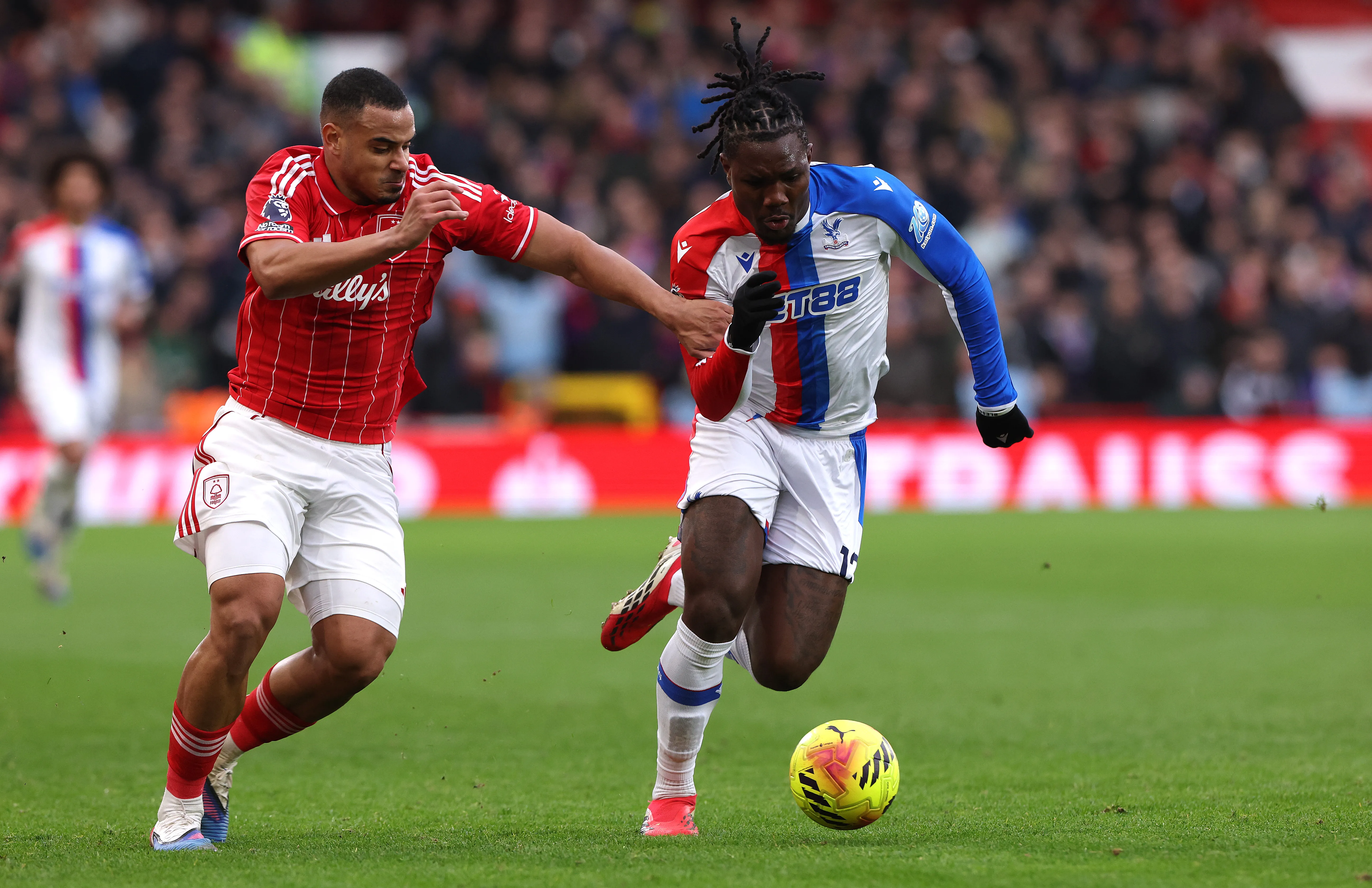 NOTTINGHAM, ENGLAND – FEBRUARY 01:  Christantus Uche of Crystal Palace moves away from Murillo during the Premier League match between Nottingham Forest and Crystal Palace at the City Ground on February 01, 2026 in Nottingham, England. (Photo by David Rogers/Getty Images)