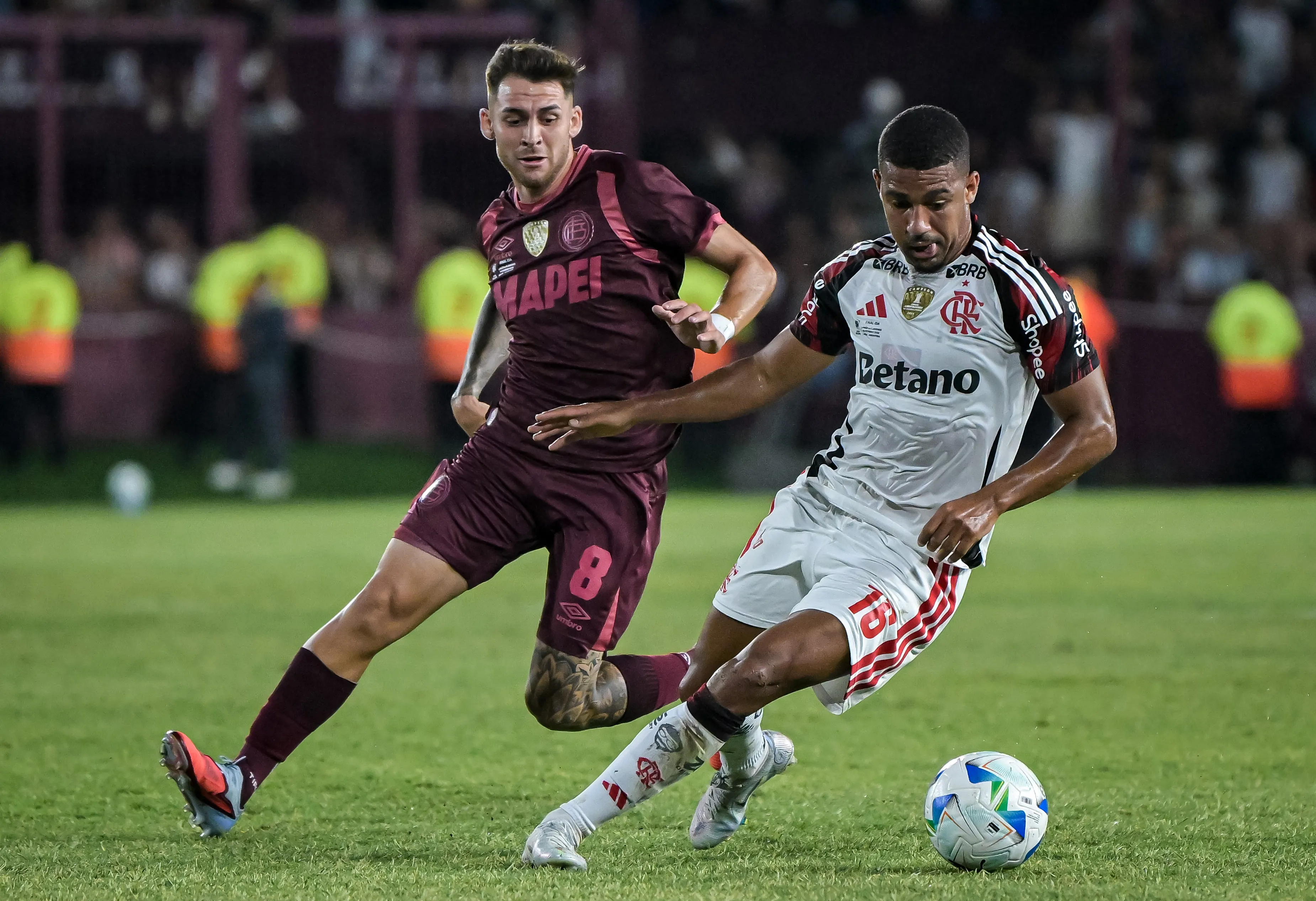Samuel Lino of Flamengo controls the ball against Franco Watson of Lanus during the CONMEBOL Recopa 2026 first-leg match between Lanus and Flamengo at Estadio Ciudad de Lanus Nestor Díaz Perez on February 19, 2026 in Buenos Aires, Argentina. (Photo by Marcelo Endelli/Getty Images)