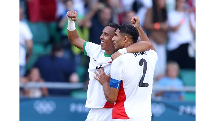 NANTES, FRANCE - AUGUST 08: Soufiane Rahimi #9 of Team Morocco celebrates scoring his team's second goal with teammate Achraf Hakimi #2 during the Men's Bronze Medal match between Egypt and Morocco during the Olympic Games Paris 2024 at Stade de la Beaujoire on August 08, 2024 in Nantes, France. (Photo by Robert Cianflone/Getty Images)