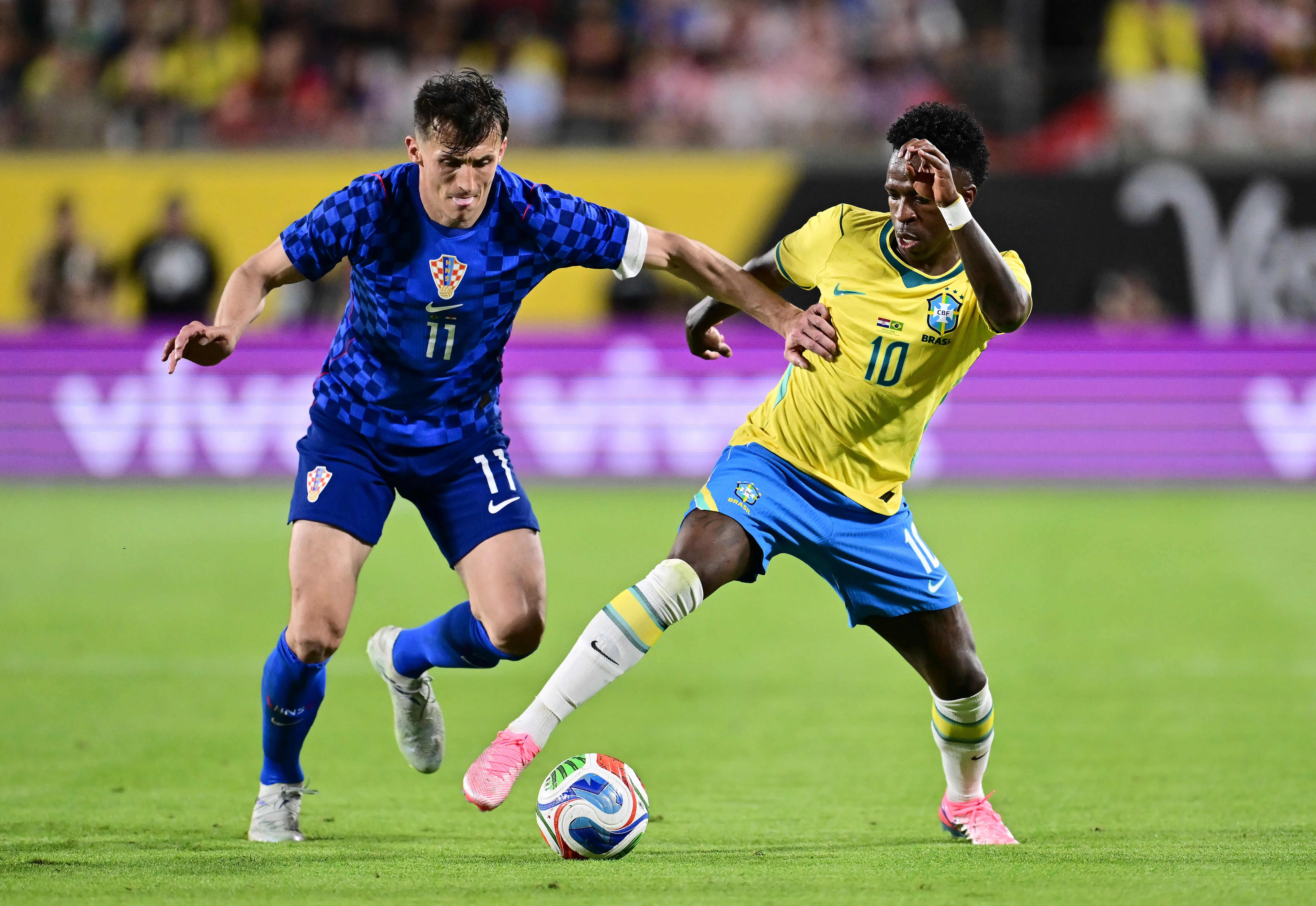 ORLANDO, FLORIDA – MARCH 31: Vinicius Junior of Brazil and Ante Budimir of Croatia compete for the ball during the international friendly match between Brazil and Croatia at Camping World Stadium on March 31, 2026 in Orlando, Florida. (Photo by Julio Aguilar/Getty Images)