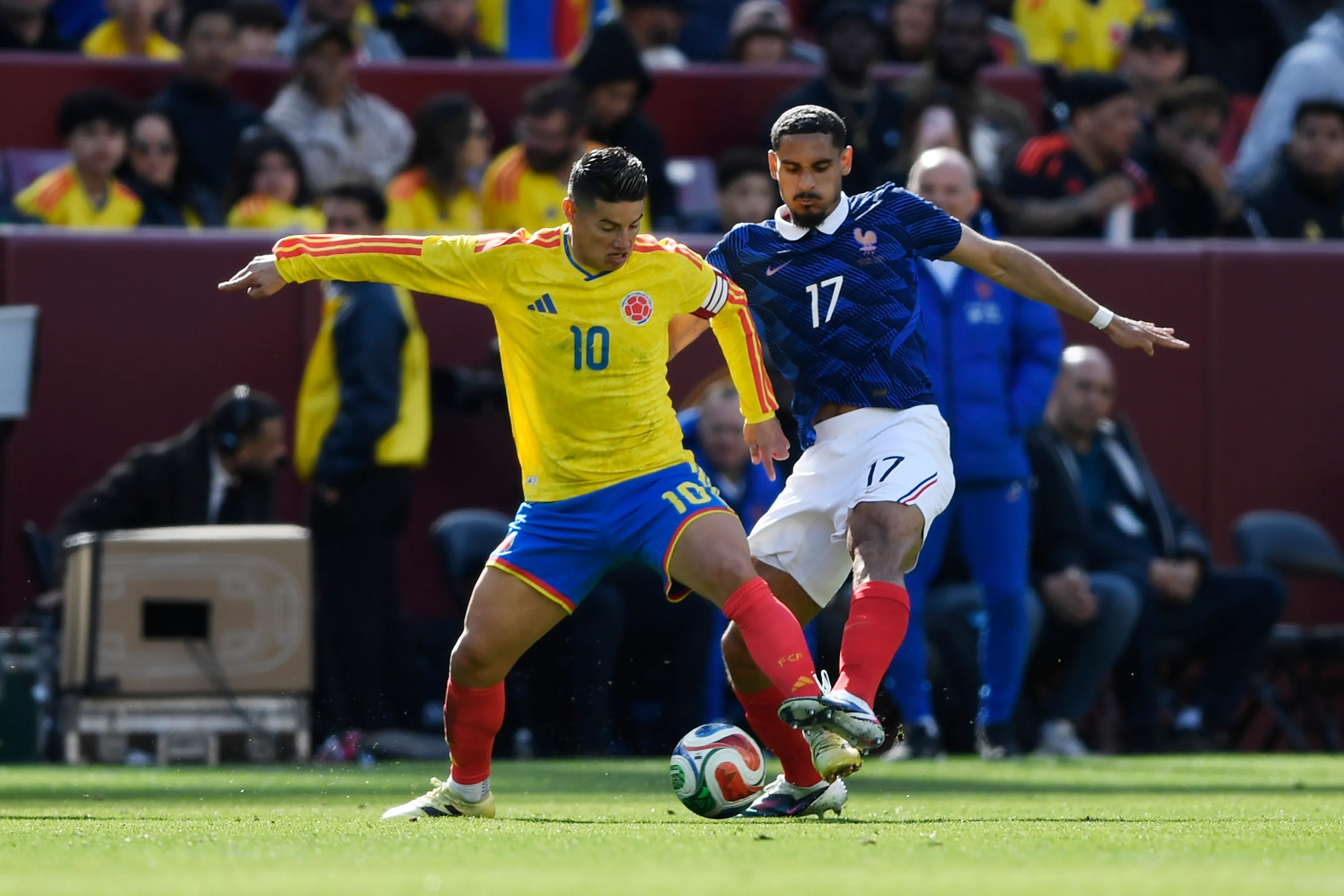 James Rodríguez of Colombia is challenged by Maxence Lacroix of France during the international friendly match between Colombia and France at Northwest Stadium on March 29, 2026 in Landover, Maryland. (Photo by Hannah Foslien/Getty Images)