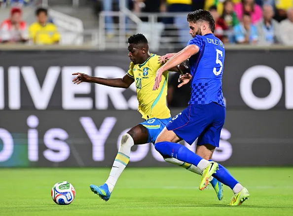 ORLANDO, FLORIDA – MARCH 31: Luiz Henrique of Brazil controls the ball against Duje Caleta-Car of Croatia during the international friendly match between Brazil and Croatia at Camping World Stadium on March 31, 2026 in Orlando, Florida. (Photo by Julio Aguilar/Getty Images)