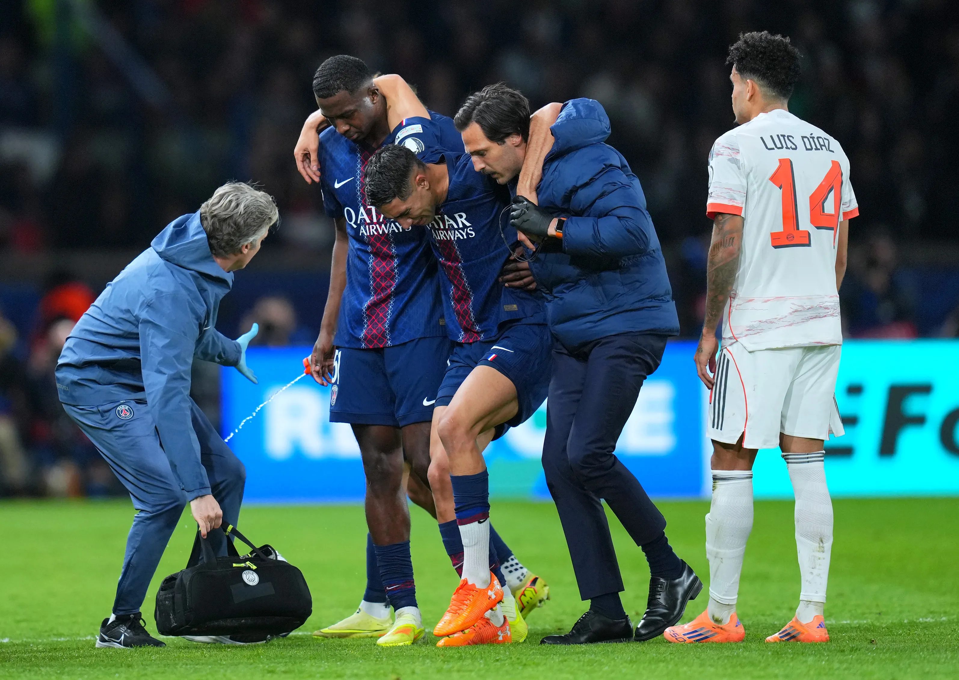 PARIS, FRANCE – NOVEMBER 04: Achraf Hakimi of Paris Saint-Germain is carried off the pitch after picking up an injury upon being fouled by Luis Diaz of Bayern Munich (not pictured) during the UEFA Champions League 2025/26 League Phase MD4 match between Paris Saint-Germain and FC Bayern München at Parc des Princes on November 04, 2025 in Paris, France. (Photo by Franco Arland/Getty Images)