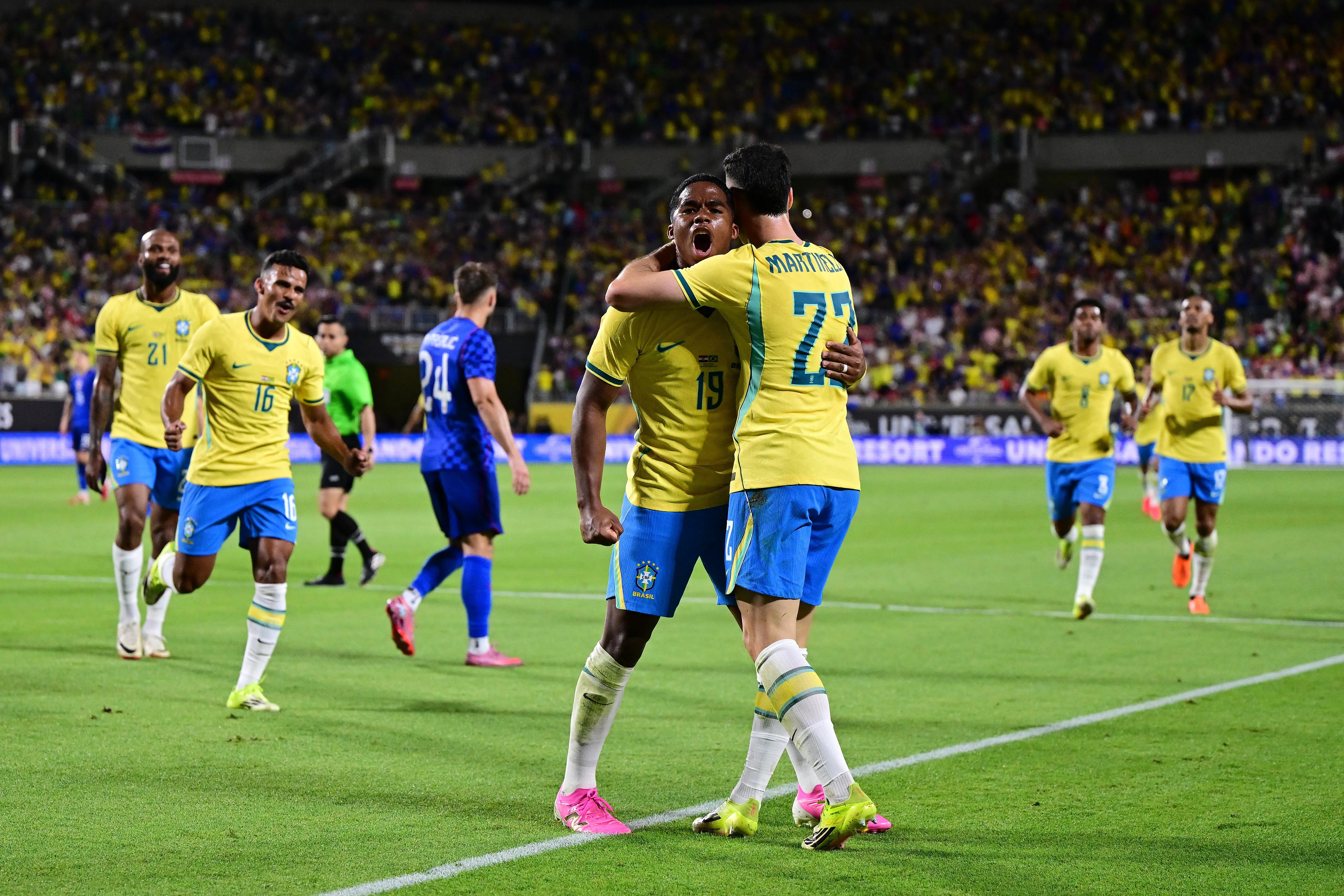 ORLANDO, FLORIDA – MARCH 31: Gabriel Martinelli of Brazil celebrates with teammate Endrick after scoring his team’s third goal during the international friendly match between Brazil and Croatia at Camping World Stadium on March 31, 2026 in Orlando, Florida. (Photo by Julio Aguilar/Getty Images)