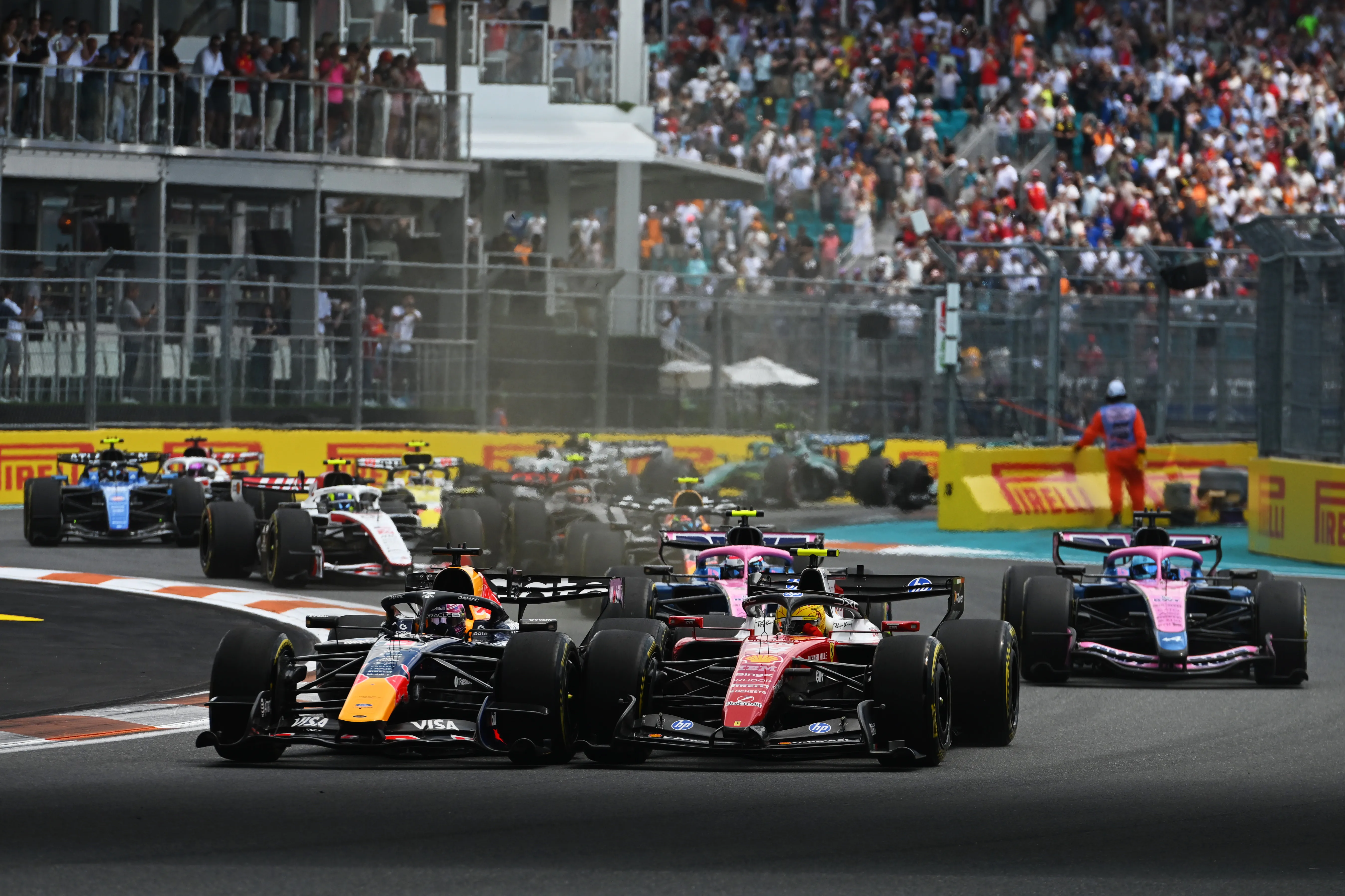 MIAMI, FLORIDA – MAY 02: Max Verstappen of the Netherlands driving the (3) Oracle Red Bull Racing RB22 Red Bull Ford and Lewis Hamilton of Great Britain driving the (44) Scuderia Ferrari SF-26 battle for track position at the start during the Sprint ahead of the F1 Grand Prix of Miami at Miami International Autodrome on May 02, 2026 in Miami, Florida. (Photo by Rudy Carezzevoli/Getty Images)
