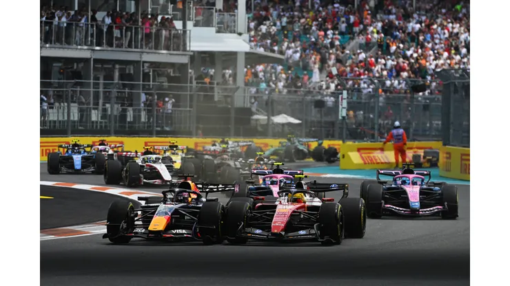 MIAMI, FLORIDA - MAY 02: Max Verstappen of the Netherlands driving the (3) Oracle Red Bull Racing RB22 Red Bull Ford and Lewis Hamilton of Great Britain driving the (44) Scuderia Ferrari SF-26 battle for track position at the start during the Sprint ahead of the F1 Grand Prix of Miami at Miami International Autodrome on May 02, 2026 in Miami, Florida. (Photo by Rudy Carezzevoli/Getty Images)