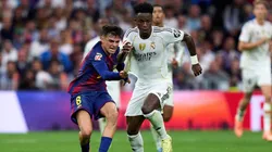 MADRID, SPAIN - OCTOBER 26: Vinicius Junior of Real Madrid is challenged by Pedri of FC Barcelona during the LaLiga EA Sports match between Real Madrid CF and FC Barcelona at Estadio Santiago Bernabeu on October 26, 2025 in Madrid, Spain. (Photo by Angel Martinez/Getty Images)