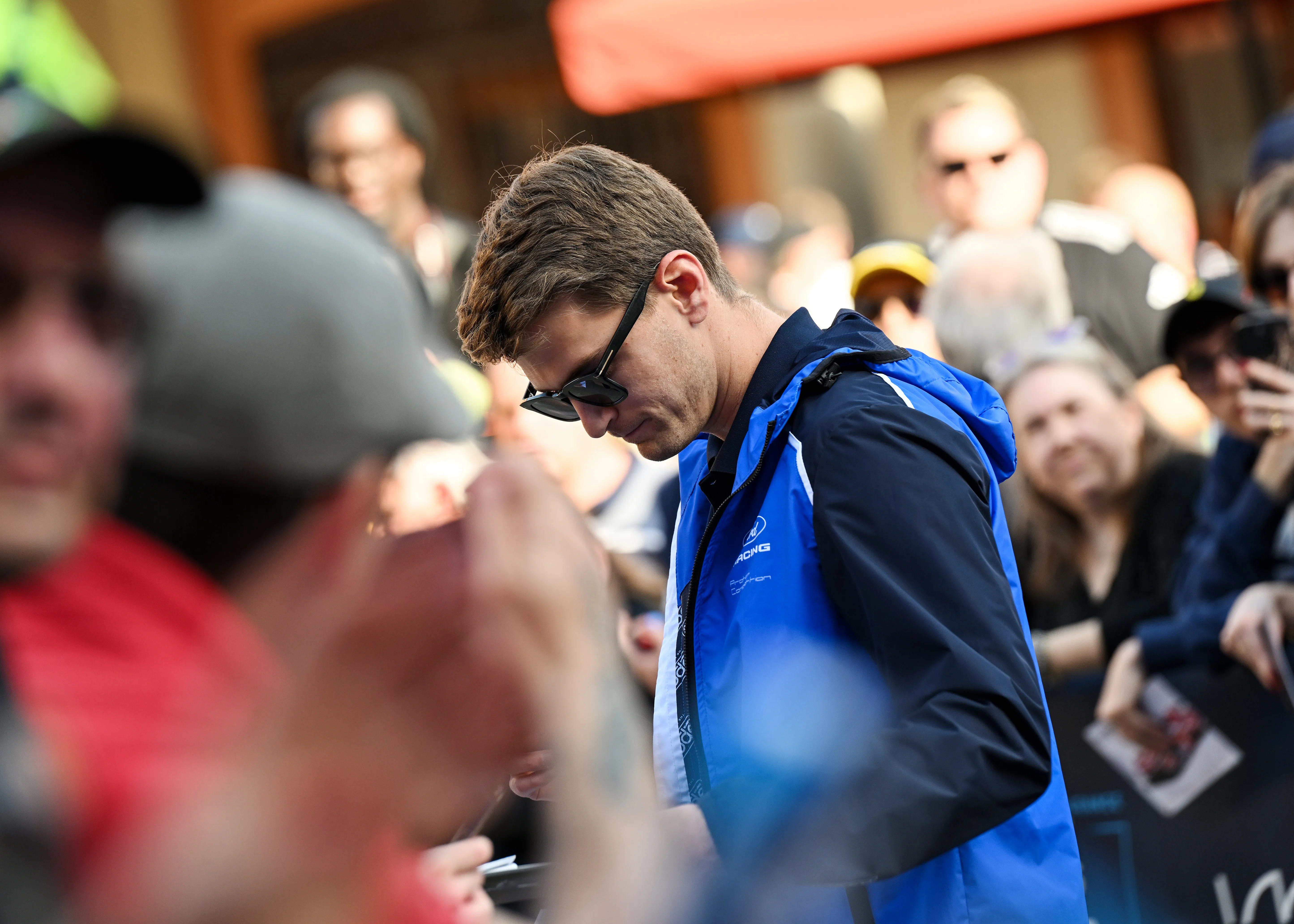 IMOLA, ITALY – APRIL 16: Logan Sargeant of United States and Proton Competition signs autographs for fans in Piazza Matteotti before the World Endurance Championship 6 Hours of Imola at Autodromo Enzo e Dino Ferrari on April 16, 2026 in Imola, Italy. (Photo by Sam Bagnall/Getty Images)