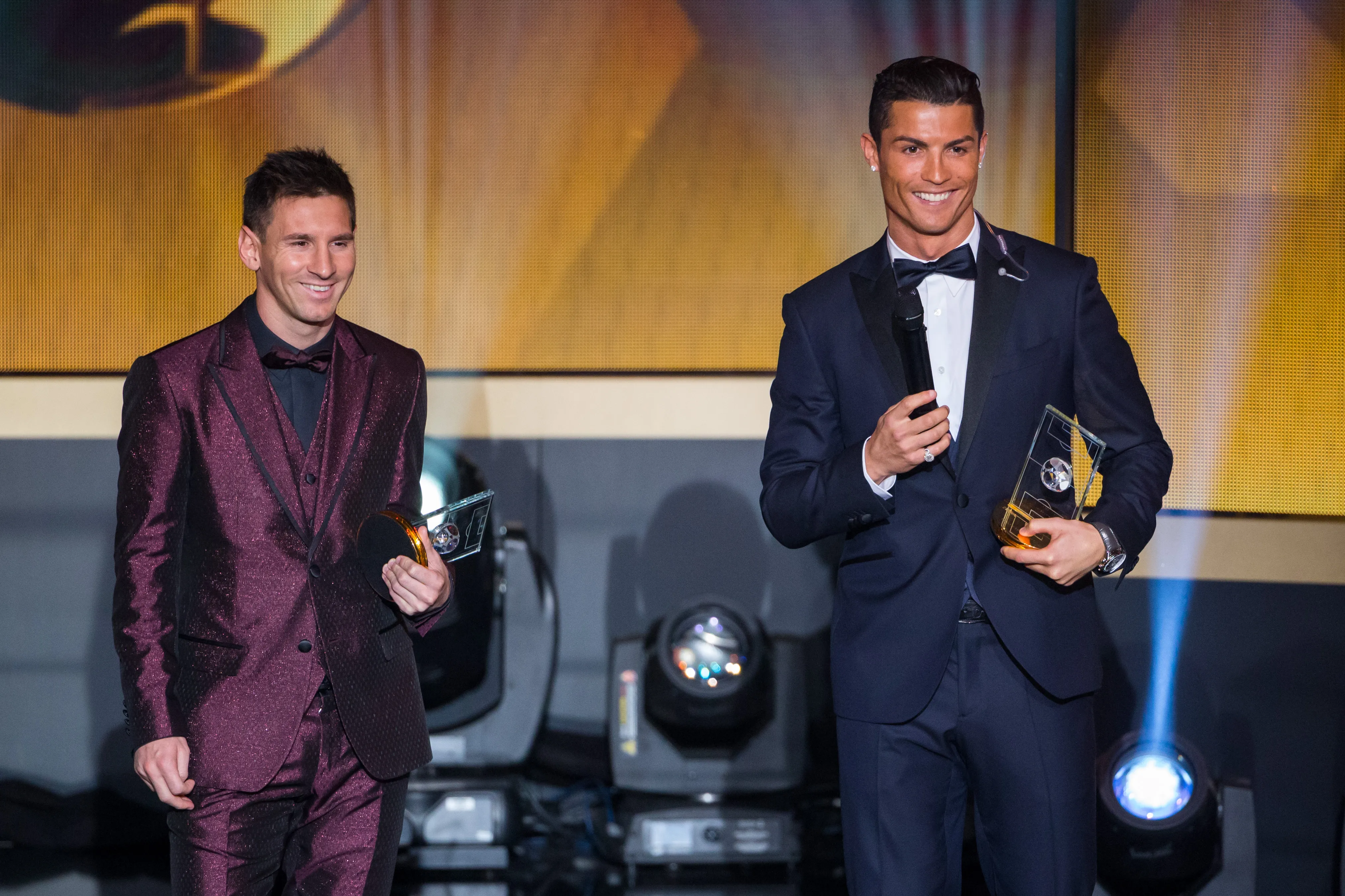 ZURICH, SWITZERLAND – JANUARY 12: FIFA Ballon d’Or nominees Lionel Messi of Argentina and FC Barcelona (L) and Cristiano Ronaldo of Portugal and Real Madrid smile during the FIFA Ballon d’Or Gala 2014 at the Kongresshaus on January 12, 2015 in Zurich, Switzerland. (Photo by Philipp Schmidli/Getty Images)