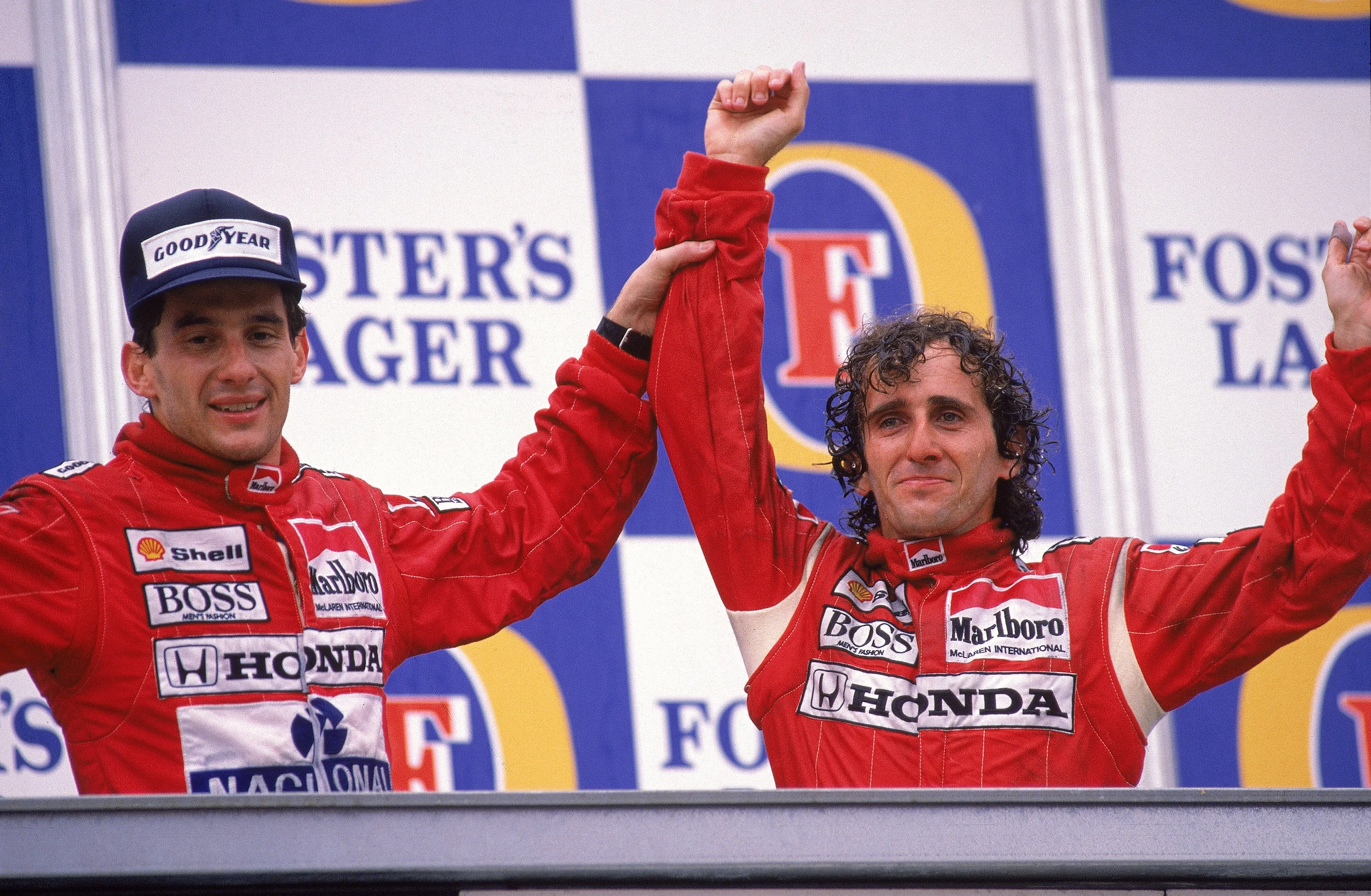 13 Nov 1988: McLaren Honda driver Alain Prost of France celebrates his victory with team-mate Ayrton Senna of Brazil who finished second after the Australian Formula One Grand Prix held in Adelaide, Australia. \ Mandatory Credit: Tony Feder /Allsport