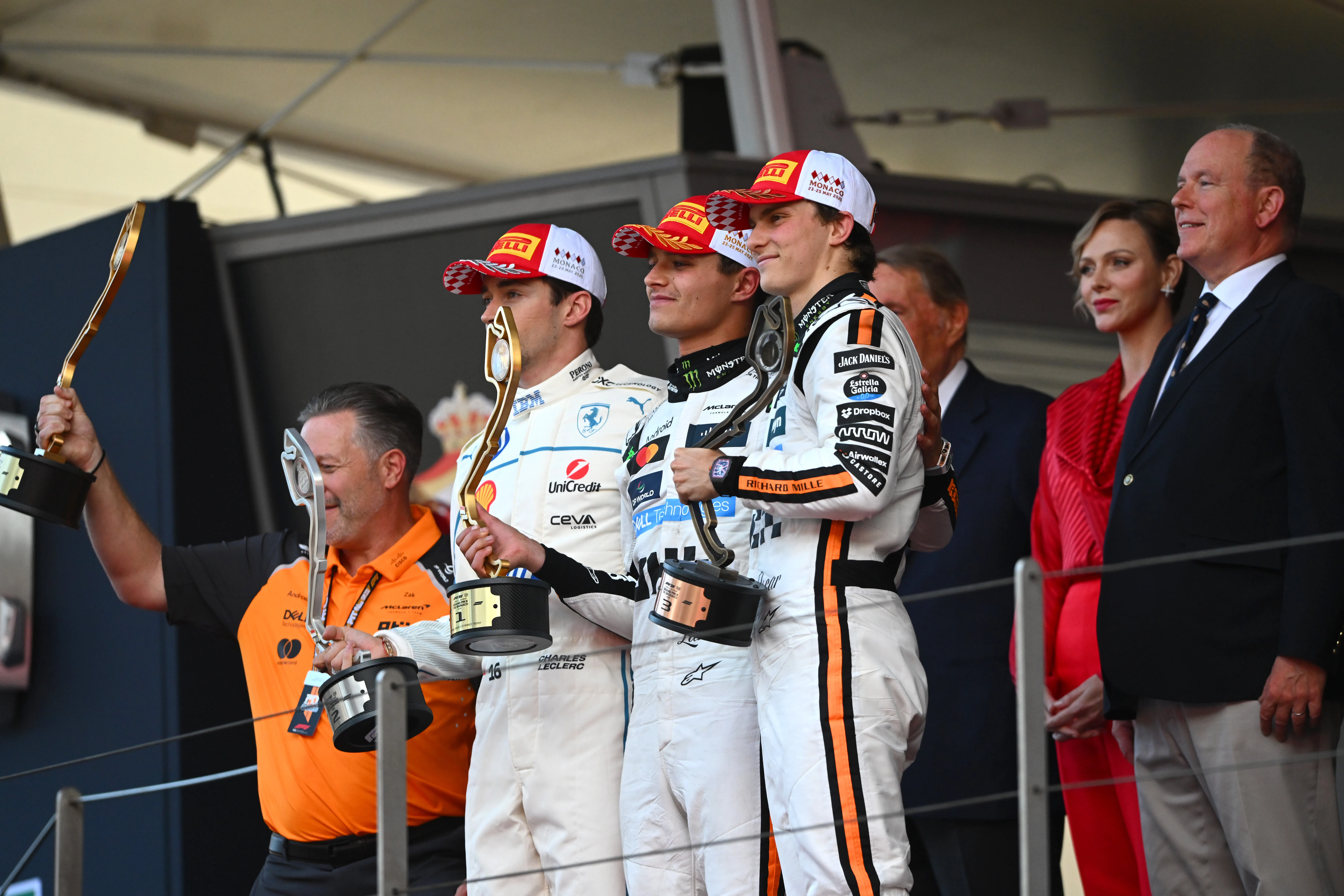 MONTE-CARLO, MONACO – MAY 25: Race winner Lando Norris of Great Britain and McLaren Second placed Charles Leclerc of Monaco and Scuderia Ferrari Third placed Oscar Piastri of Australia and McLaren and Zak Brown, Chief Executive Officer of McLaren on the podium during the F1 Grand Prix of Monaco at Circuit de Monaco on May 25, 2025 in Monte-Carlo, Monaco. (Photo by Rudy Carezzevoli/Getty Images)