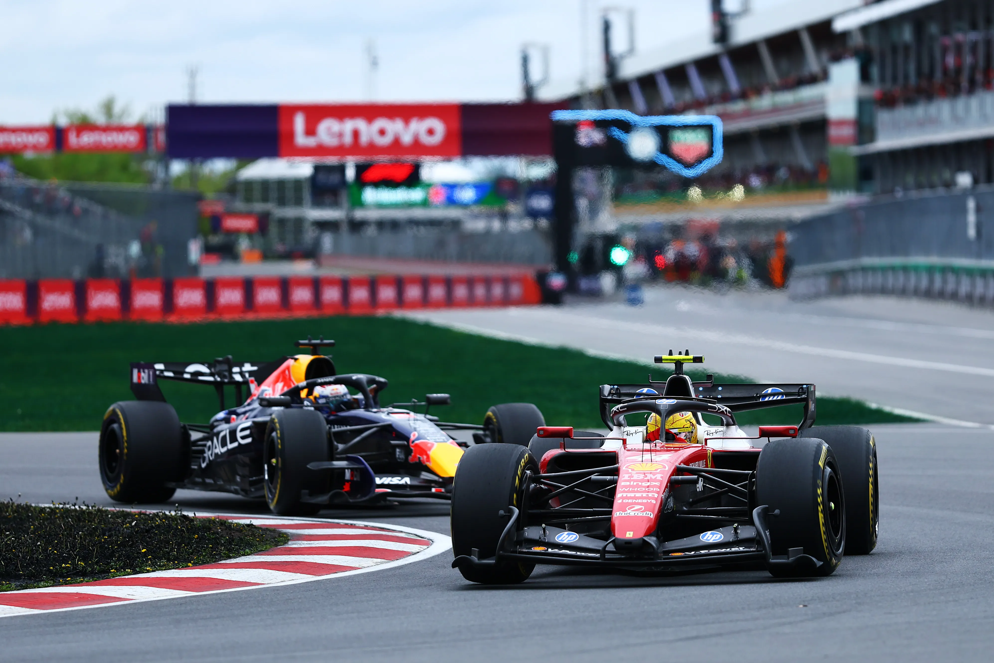 MONTREAL, QUEBEC – MAY 24: Lewis Hamilton of Great Britain driving the (44) Scuderia Ferrari SF-26 leads Max Verstappen of the Netherlands driving the (3) Oracle Red Bull Racing RB22 Red Bull Ford on track during the F1 Grand Prix of Canada at Circuit Gilles-Villeneuve on May 24, 2026 in Montreal, Quebec. (Photo by Clive Mason/Getty Images)